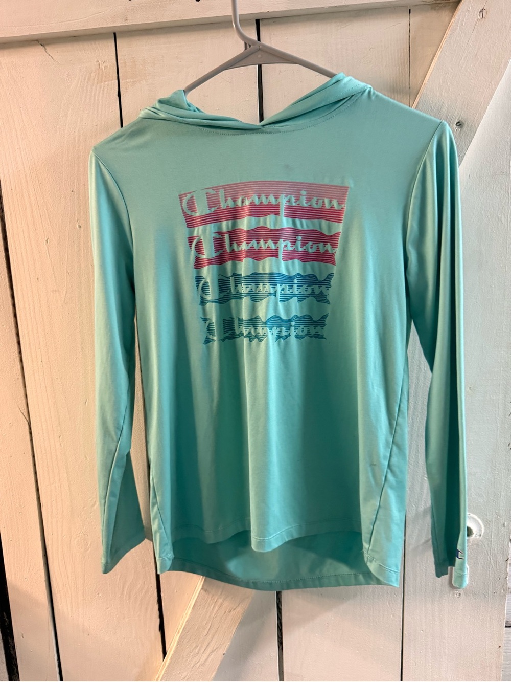 Champion Aqua this Hooded long sleeve shirt with Striped Logo Graphic